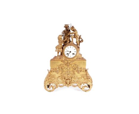 An ornate 19th Century French gilt metal mantel clock, the white enamel roman dial and drum movement, the case with two figur