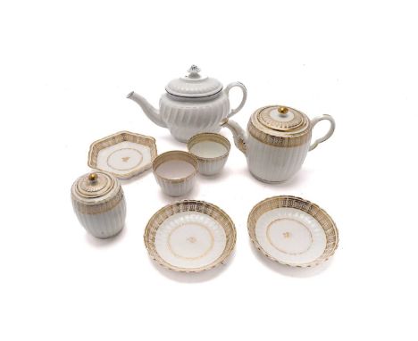 A late 18th-century Caughley part tea service, of ribbed form with gilt loop and dot borders, comprising: teapot, cover and s