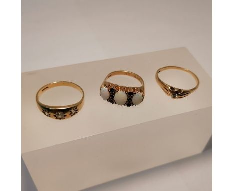 A collection of three 9ct gold dress rings. Featuring a three stone opal ring, studded with sixed small round sapphires, size