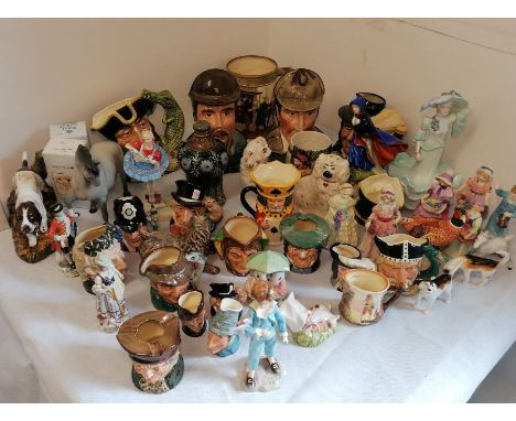 A collection of Royal Doulton figurines, jugs and an early 20th century stoneware whisky flagon.Figures include "May" HN2746 