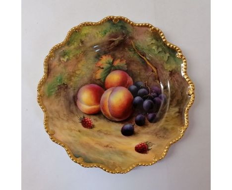 A Royal Worcester hand painted with fruit plate. Signatures include T Lockyer. Puce mark. Approximately 22 cm.In good conditi