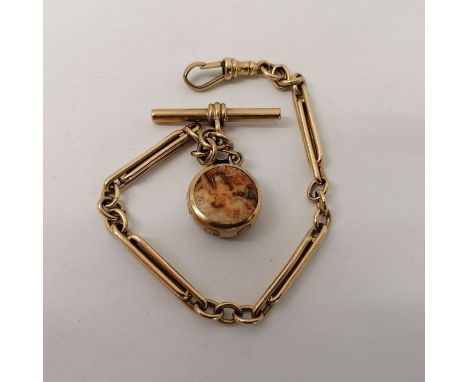 A bar link watch chain with a fob clip, T-bar and an agate and onyx 9ct gold pendant. Approximate length 21cms. Gross total w