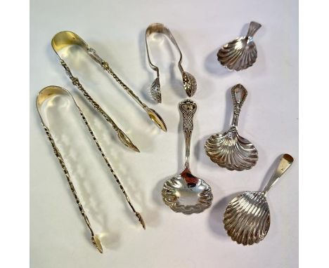 A collection of three sugar tongs (one possibly 18th Century) and four caddy spoons (two Georgian, two Victorian). Approximat