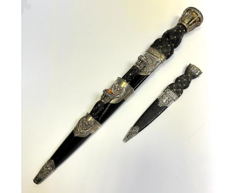 A Gordon Highlanders officers dirk together with a Sgian Dubh  (a ceremonial stabbing knife). Both items were typically worn 