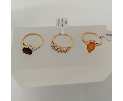 Three 9ct gold dress rings by Gemporia. One a Prasiolite and white stone ring, size P; a heart shaped garnet and zircon ring,