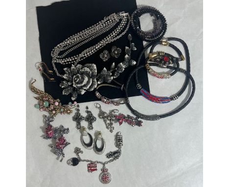 A selection of monochrome Butler and Wilson costume jewellery. Featuring a 22cm long rhinestoned grey and white trailing rose