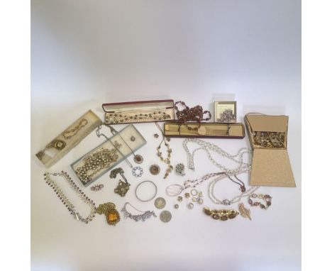 A collection of costume jewellery to include simulated pearls, rhinestone pieces and other items, plus an Accurist gents watc