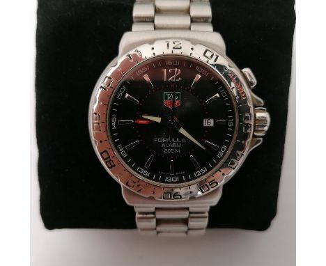 A Tag Heuer Formula 1 gentleman's wristwatch. With black dial and silvered Arabic numeral/batons. Date aperture to the dial.&
