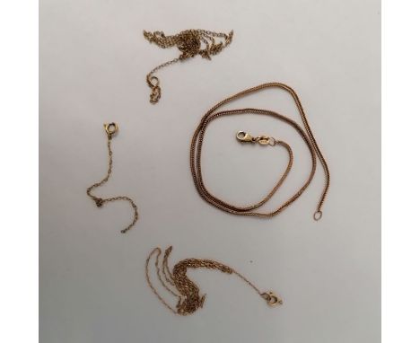 A selection of three chains. One a hallmarked 9ct snake chain plus a 9ct stamped broken chain and a further broken yellow met