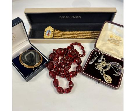 A collection of antique and vintage silver and costume jewellery, To include an amethyst set silver crescent brooch; a gilded