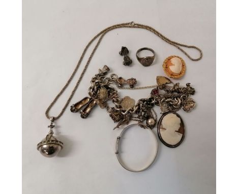 A collection of silver jewellery. Featuring a ruby set silver pendant styled as the coronation orb from the British Crown jew