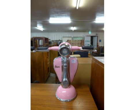 A pink Vespa table lamp