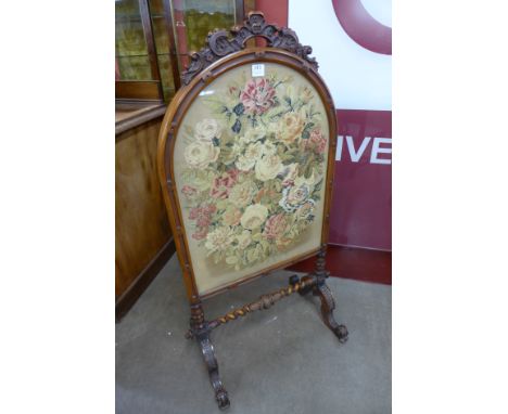 A Victorian walnut embroidered firescreen