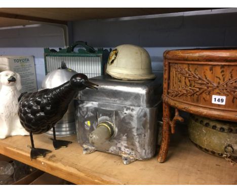 Shelf of assorted including vintage helmet, pot dog, planter etc.