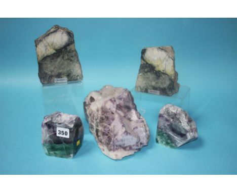 A large piece of amethyst, a pair of bookends and a pair of Skye marble book ends