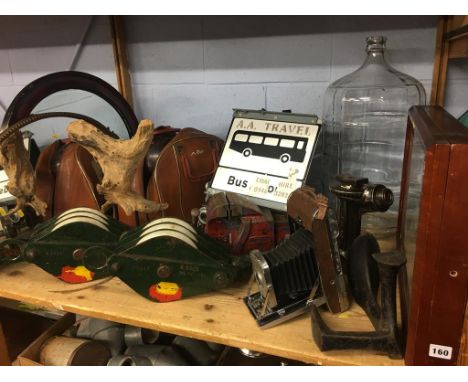 Shelf of assorted including a bowling ball, mirrors etc.