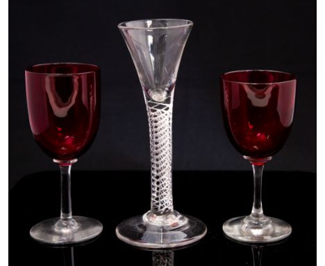 An 18th Century air twist line glass, conical bowl, height 16.5, together with a pair of Victorian ruby wine glasses (3)CONDI