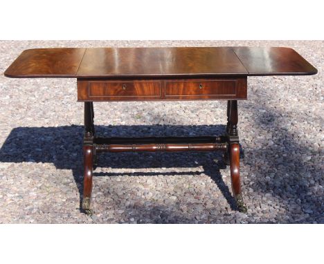 A Regency mahogany sofa table with solid flame mahogany top