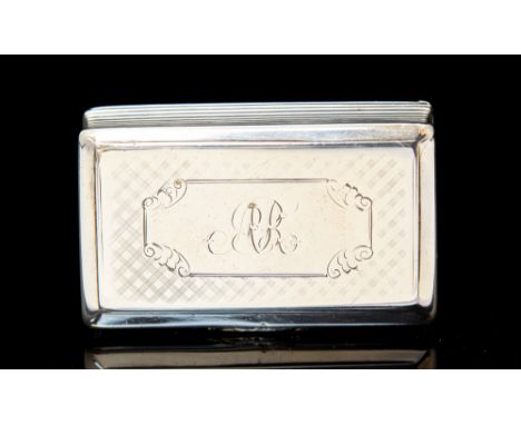 An early Victorian silver snuff box, rectangular with reeded sides, the cover and base engraved with geometric decoration, th