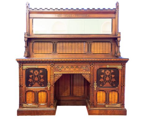 A Victorian Reformed Gothic oak sideboard in the manner of Charles Bevan, circa 1870, the whole with extensive ebony stringin