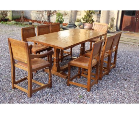 Robert 'Mouseman' Thompson, a circa 1930's Mouseman oak dining suite, comprising an adzed top dining table, six side chairs a