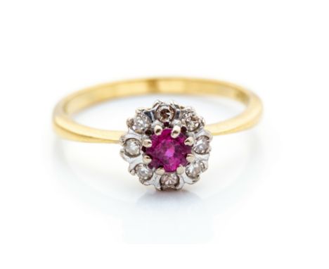 A ruby and diamond cluster ring, the centre ruby approx 4mm diam, 8 small round eight-cuts to surround, 18ct yellow gold shan