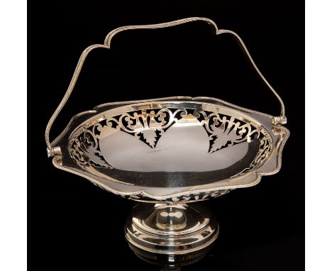 A George V shaped circular silver pedestal basket, with swing handle, pierced decoration to the rim, Birmingham, 1921, maker'