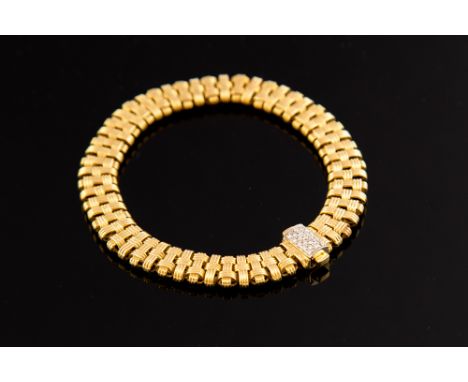 A Roberto Coin 18ct yellow gold fancy link bracelet, with interwoven design to links  diamonds and ruby set to the clasp, len