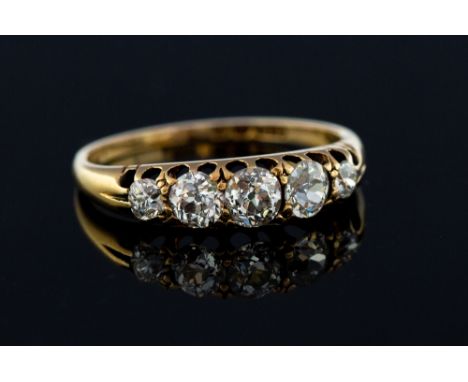 A diamond five-stone 18ct yellow gold ring, the boat shaped head containing five round old-cut diamonds, calculated total dia