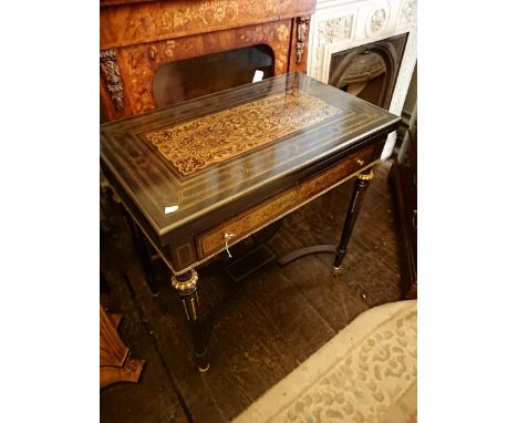 A 19th Century French Boulle fold-over card table, having a single drawer