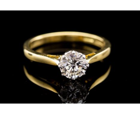 A diamond solitaire 18ct gold ring, the round brilliant cut diamond approximately 0.72 carat, assessed colour H, assessed cla