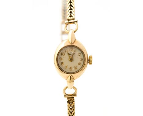 J.W. Benson, a circa 1950's 9ct gold J.W.Benson lady's cocktail wristwatch, 1cm circular champagne dial, integral 9ct gold br