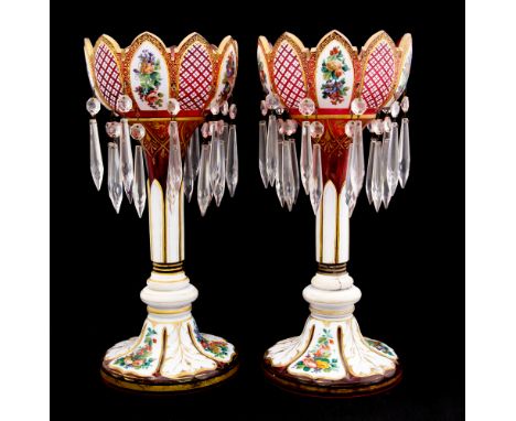 A pair of mid 19th Century ruby opaque cased glass table lustres, circa 1850, ogee rims, double row tapered cut glass dropper