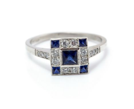 A sapphire and diamond ring, the square top set with a central square checkerboard cut sapphire approx. along with a further 