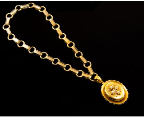 A Victorian 15ct gold diamond and pearl set locket pendant and chain, the oval pendant applied to centre with a cross motif c