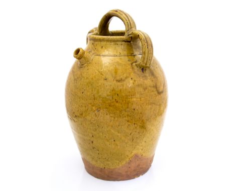 A late 19th Century provincial West Country stoneware cider pitcher, triple handle with an all-over caramel glaze, height 38c