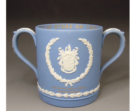 A Wedgwood white on pale blue jasper loving cup, produced in 1975 to commemorate The Golden Jubilee of Stoke on Trent being g