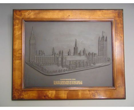 A Wedgwood black basalt plaque depicting The Palace of Westminster in London, mounted in a walnut frame, the plaque is No 2 o