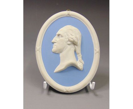 A Wedgwood oval blue and white jasper portrait plaque of George Washington, mid 20th Century, marked WEDGWOOD, J, 11cm by 8.5