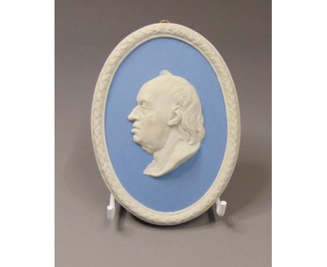 A Wedgwood oval blue and white jasper portrait plaque of Dr Johnson, mid 20th Century, marked WEDGWOOD, Made in England, 53, 