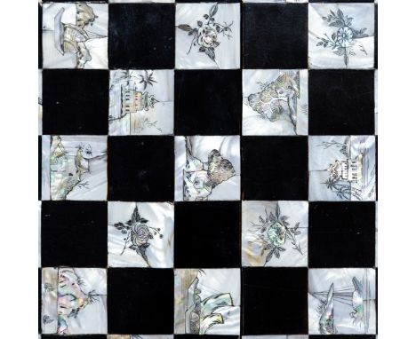 An early 20th Century Chinese export black lacquer folding games board, inset and engraved mother of pearl decoration, 64cm b