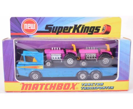 Boxed Matchbox Superkings K21 Tractor Transporter, metallic blue transporter, with two mod Tractors, in original mint boxed c