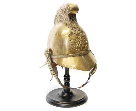 Victorian fireman's brass helmet, Victorian fireman's brass helmet, on wood stand. 26cm high 