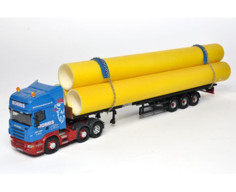 Corgi 1/50 diecast model truck issue comprising Alan Marshall Code 3 Adapted Scania Trailer with pipe load in the livery of M