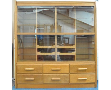 A stunning large mid 20th century retro vintage haberdashery point of sale shop display cabinet fitting comprising of two gla