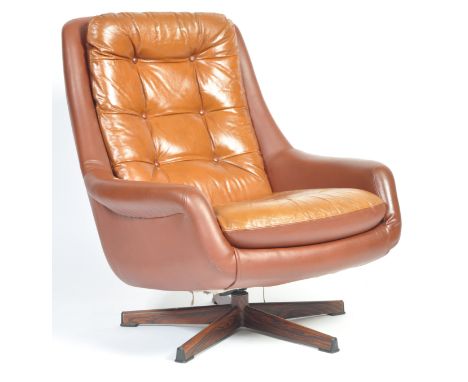 A 1970's retro vintage swivel easy / lounge chair / armchair comprising of a vinyl upholstered frame with armrests and vinyl 