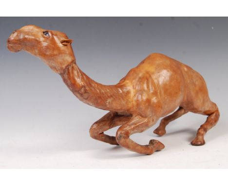 A 20th century retro vintage leather clad hand made wooden model depicting a camel modelled in a reclined position with detai