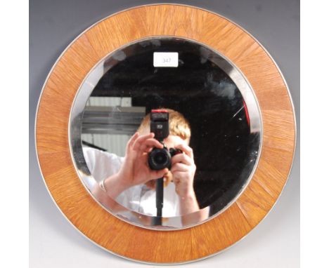 Rowley Design - A late 20th century retro vintage vanity wall hanging frameless mirror of round form having bevelled rim back