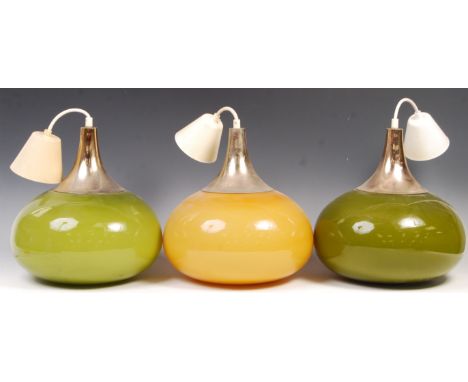 A set of three 20th century retro vintage glass ceiling lamp / pendant light fixtures having bulbous teardrop glass shades wi