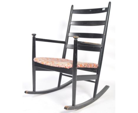 Niels Eilersen - A 20th Century 1960's Danish retro vintage rocking chair having a ladder back raised on shaped sleigh rocker